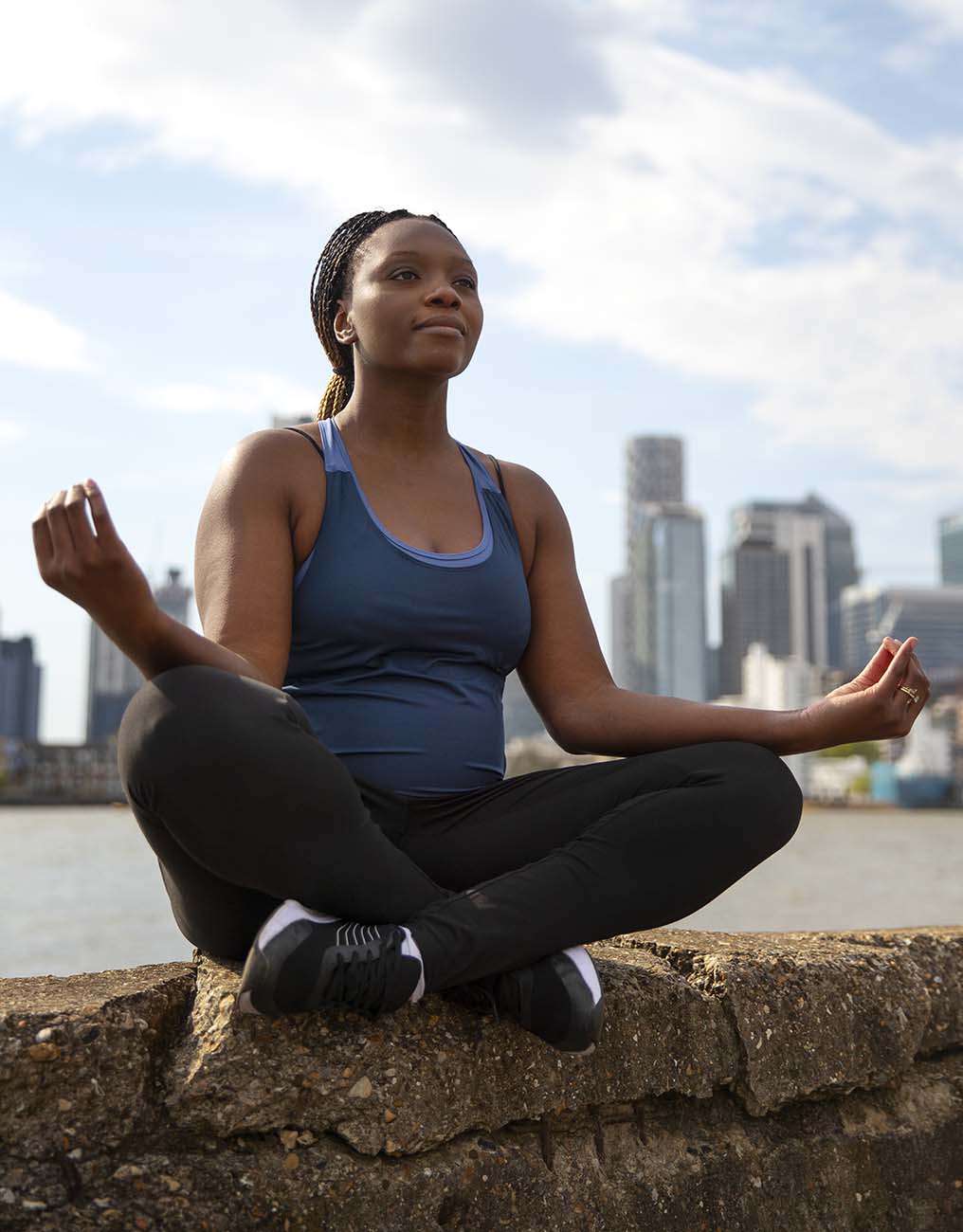 Young African woman in peaceful individual wellness session