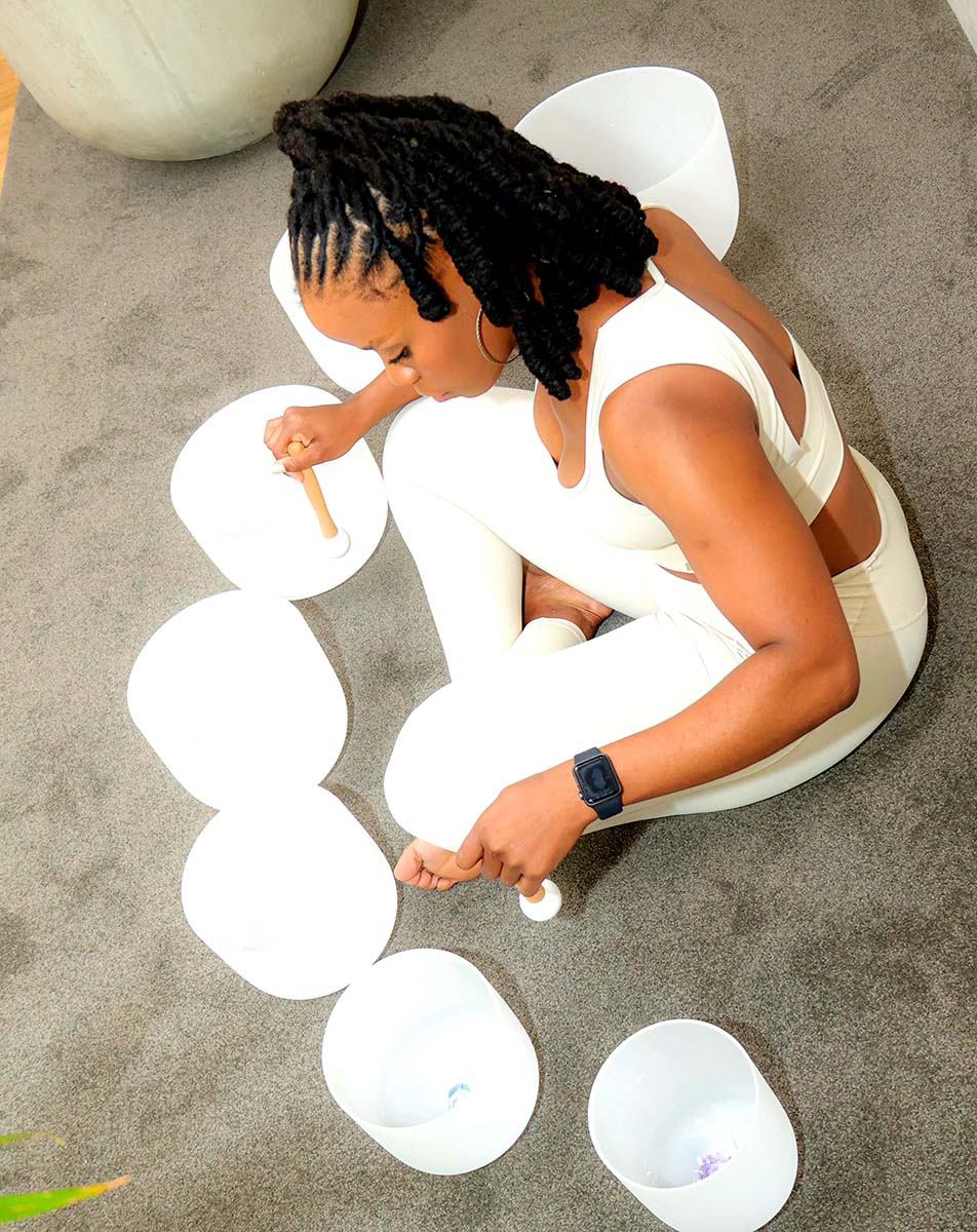 A calming sound healing session featuring multiple crystal singing bowls used for meditation, energy alignment, and deep relaxation at Mint Sanctuar